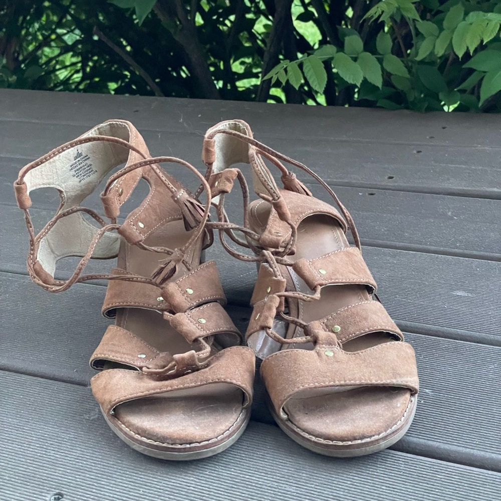 Open toe, beige, laced up heels.